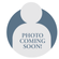 A placeholder image of a person silhouette with the text "PHOTO COMING SOON!" written in capital letters across the torso area. The silhouette is set against a bi-color circular background.